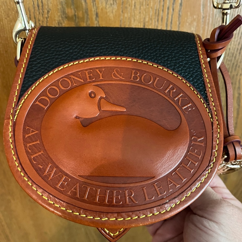 Dooney & Bourke Black and Brown Messenger Bag with Circular Design